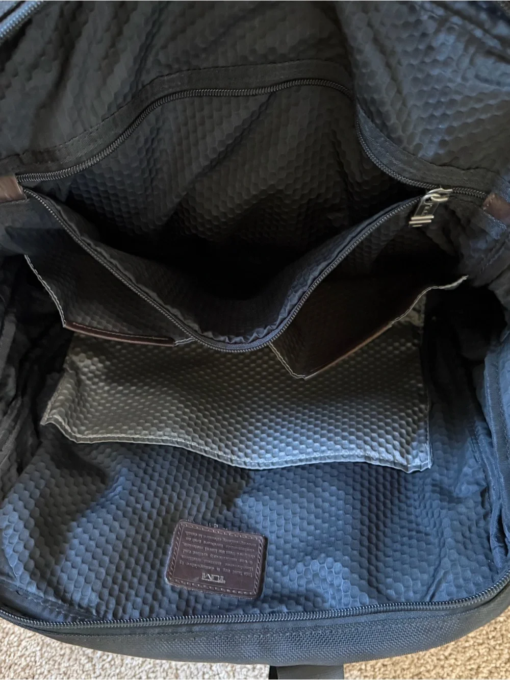 Tumi Black Backpack with Brown Leather Accents
